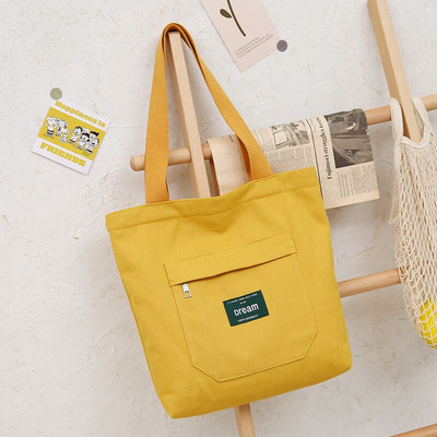 Sieviešu audekla soma ar priekšējo kabatu un plecu rokturiem