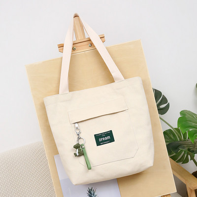 Sieviešu audekla soma ar priekšējo kabatu un plecu rokturiem