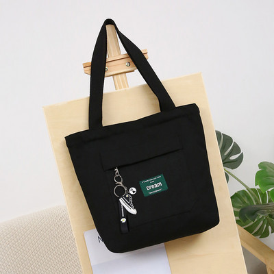 Sieviešu audekla soma ar priekšējo kabatu un plecu rokturiem