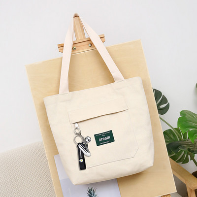 Sieviešu audekla soma ar priekšējo kabatu un plecu rokturiem