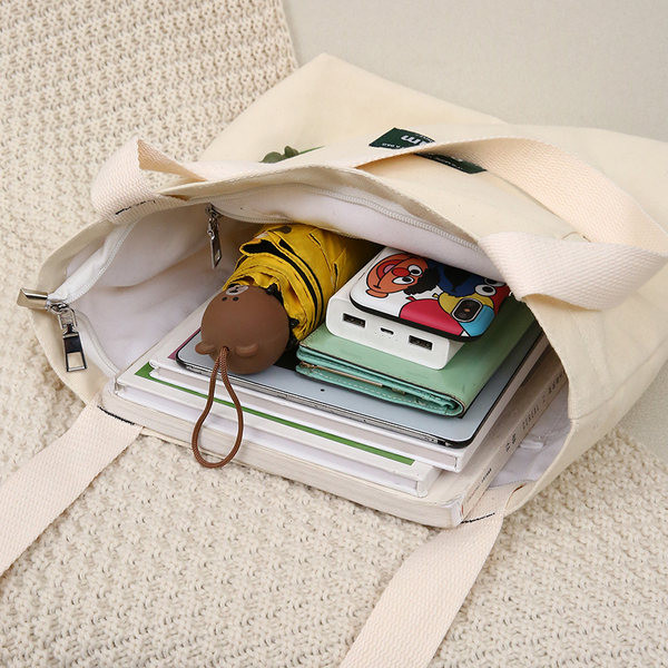 Sieviešu audekla soma ar priekšējo kabatu un plecu rokturiem