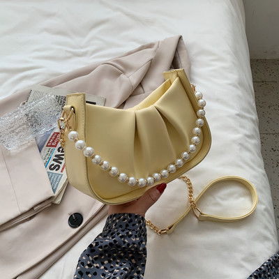 Γυναικεία έκο δερμάτινη τσάντα με κοντή  λαβή από πέρλες και μακριά μεταλλική λαβή