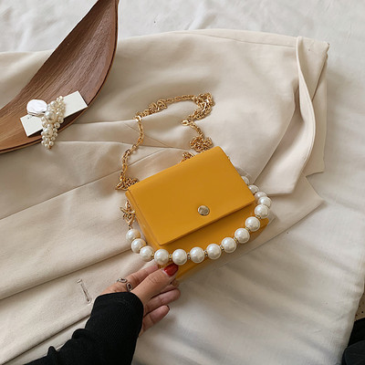 Κομψή γυναικεία τσάντα με μακρές και κοντές λαβές