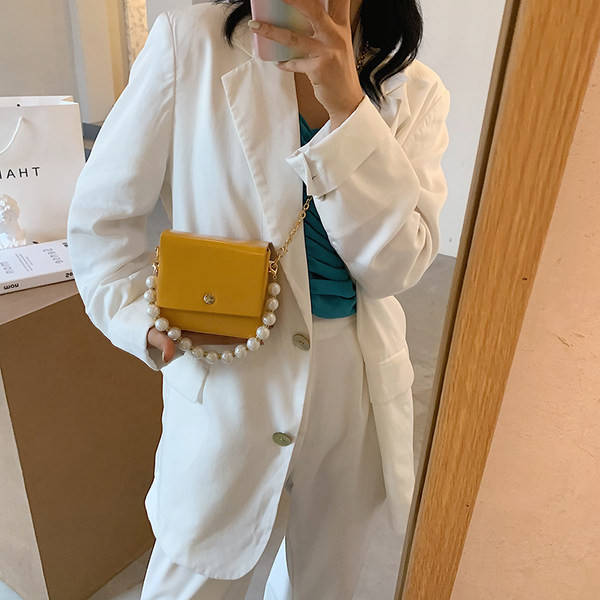 Κομψή γυναικεία τσάντα με μακρές και κοντές λαβές