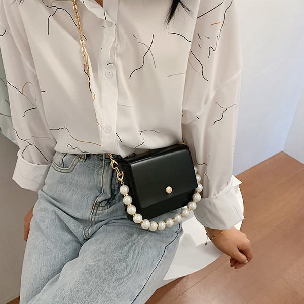 Κομψή γυναικεία τσάντα με μακρές και κοντές λαβές