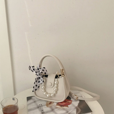 Μικρή γυναικεία έκο δερμάτινη τσάντα με μεταλλικό κούμπωμα και πέρλες