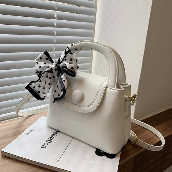 Μικρή έκο δερμάτινη τσάντα με υφασμάτινη κορδέλα και δύο λαβές