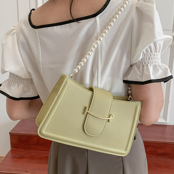 Γυναικεία εκο δερμάτινη τσάντα με πέρλες