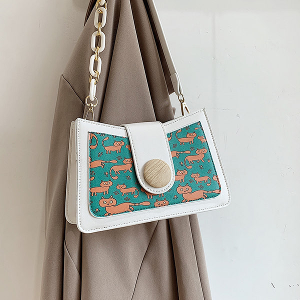 Sieviešu kvadrātveida soma ar aplikāciju un garu rokturi