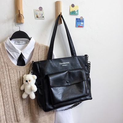 Γυναικεία τσάντα από οικολογικό δέρμα με επιγραφή