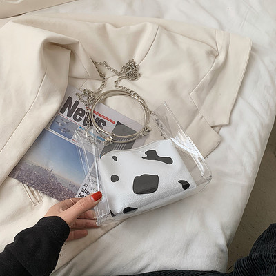 Sieviešu caurspīdīga soma ar metāla riņķi un garu rokturi