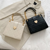 Sieviešu ādas soma ar metāla aizdari un rokturiem