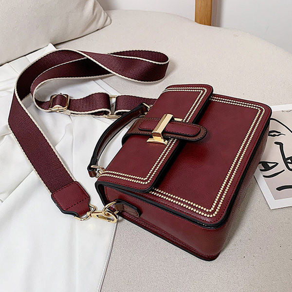 Sieviešu ādas soma ar diviem rokturiem un metāla aizdari