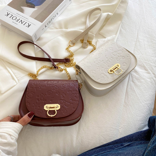 Geanta de dama din piele cu maner lung metalic