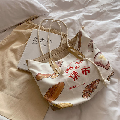 Γυναικεία υφασμάτινη τσάντα με εφαρμογές - με κοντή λαβή