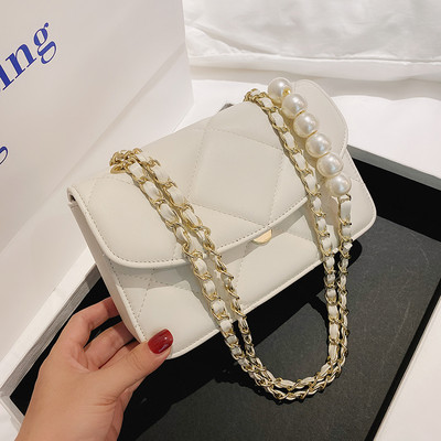 Γυναικεία τσάντα από οικολογικό δέρμα με μακριά λαβή και πέρλες