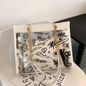 Moderna liela soma ar caurspīdīgu daļu un uzrakstiem