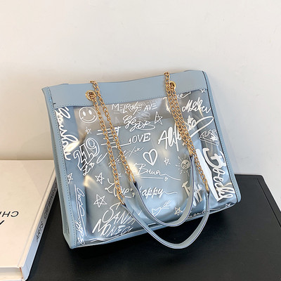 Moderna liela soma ar caurspīdīgu daļu un uzrakstiem