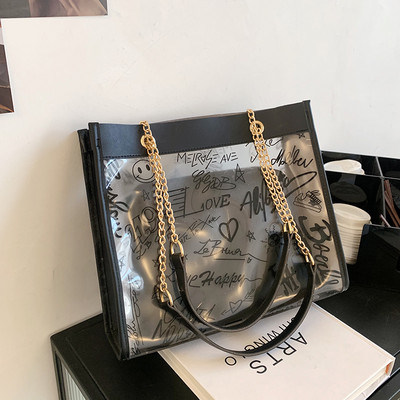 Moderna liela soma ar caurspīdīgu daļu un uzrakstiem