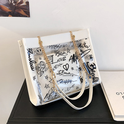 Moderna liela soma ar caurspīdīgu daļu un uzrakstiem