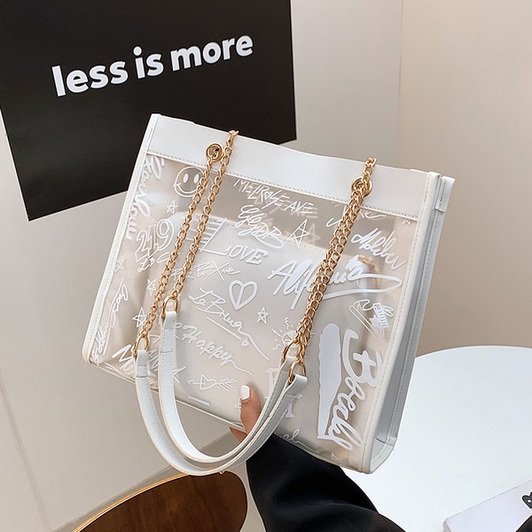 Moderna liela soma ar caurspīdīgu daļu un uzrakstiem