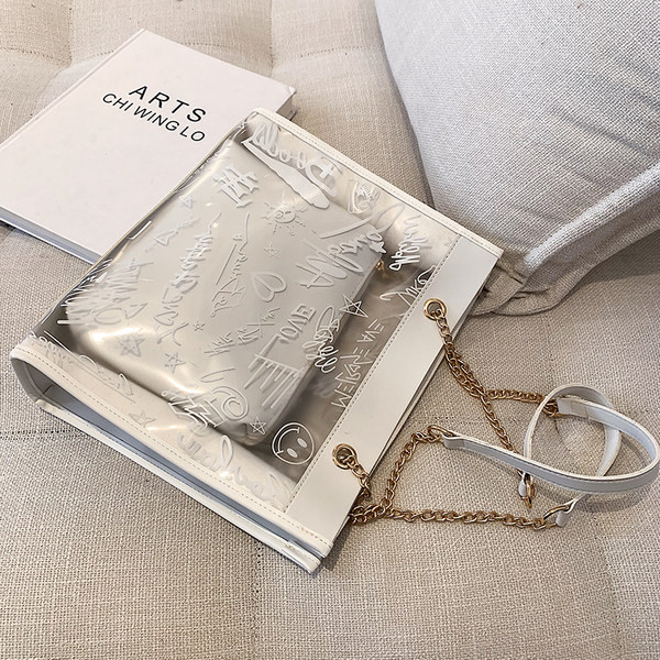 Moderna liela soma ar caurspīdīgu daļu un uzrakstiem