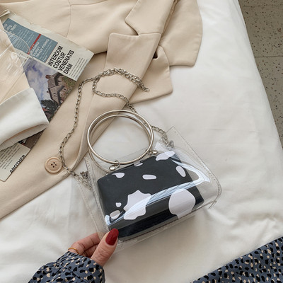 Caurspīdīga sieviešu soma ar metāla rokturiem