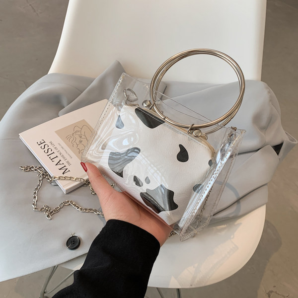 Caurspīdīga sieviešu soma ar metāla rokturiem