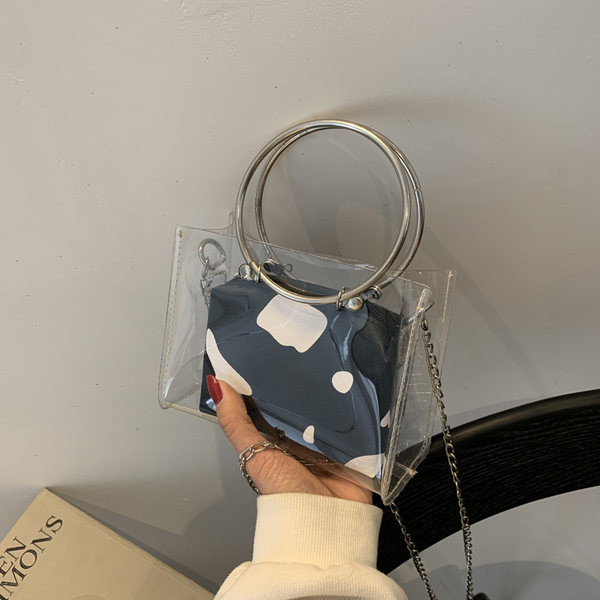 Caurspīdīga sieviešu soma ar metāla rokturiem