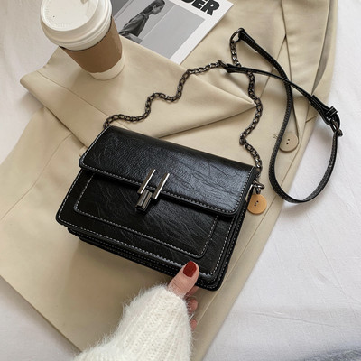 Geanta din piele cu maner lung si inchidere metalica