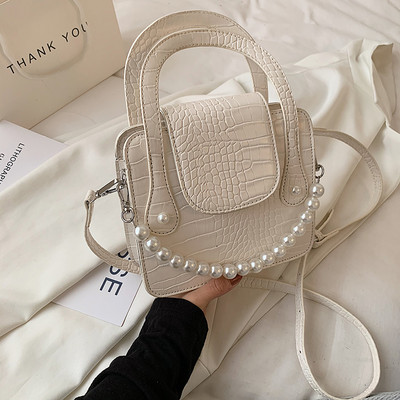 Μικρή ανάγλυφη δερμάτινη τσάντα με λάβη με πέρλες