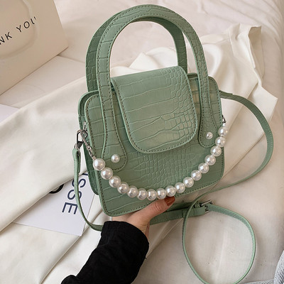 Μικρή ανάγλυφη δερμάτινη τσάντα με λάβη με πέρλες