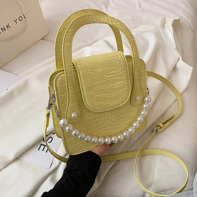 Μικρή ανάγλυφη δερμάτινη τσάντα με λάβη με πέρλες