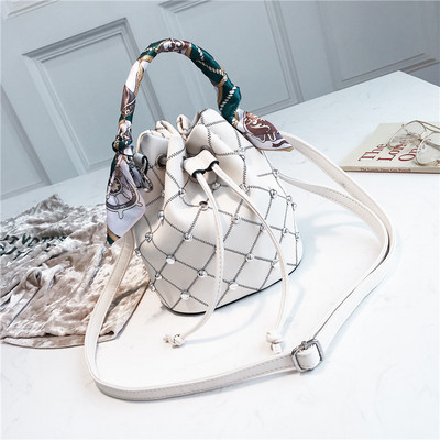 Καθημερινή έκο δερμάτινη τσάντα με κορδόνια  και μεταλλικά στοιχεία