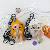 Dāmas soma ar uzrakstu un plīša rotaļlietu