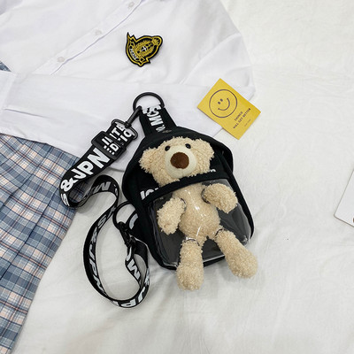 Dāmas soma ar uzrakstu un plīša rotaļlietu