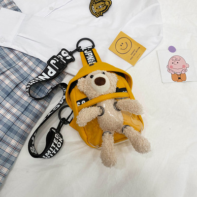 Dāmas soma ar uzrakstu un plīša rotaļlietu