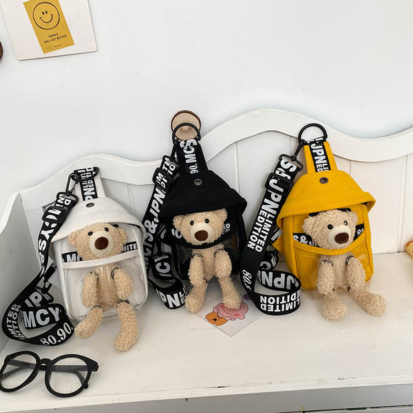 Dāmas soma ar uzrakstu un plīša rotaļlietu