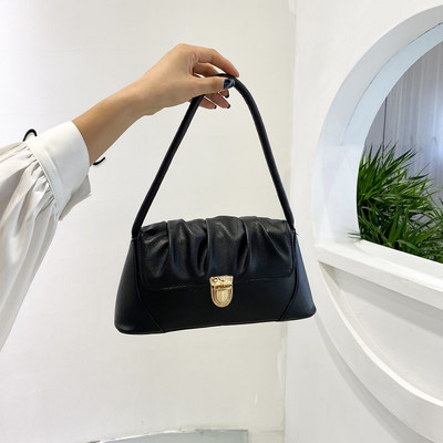 Γυναικεία έκο δερμάτινη τσάντα με μεταλλικό κούμπωμα και λαβή