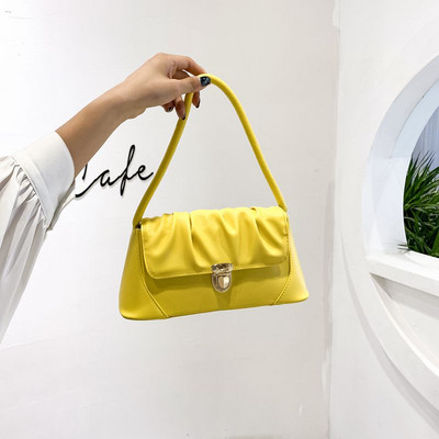 Γυναικεία έκο δερμάτινη τσάντα με μεταλλικό κούμπωμα και λαβή