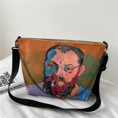 Γυναικεία τσάντα με χρωματιστό απλικέ και μεταλλικό στοιχείο