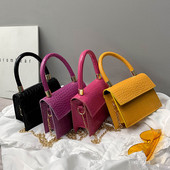 Elegantiška kelių spalvų moteriška rankinė su metalinėmis rankenomis