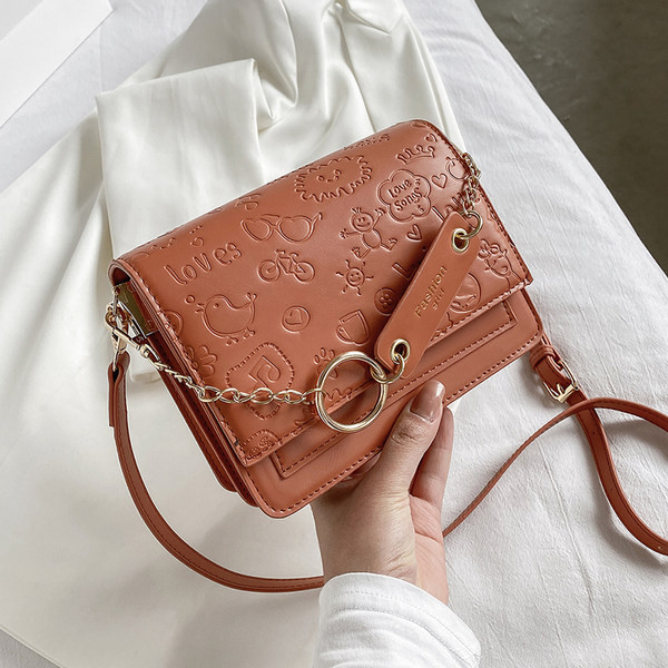 Σύγχρονη γυναικεία τσάντα από ανάγλυφο δέρμα με κοντές και μεγάλες λαβές