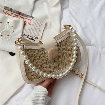 Γυναικεία τσάντα με δερμάτινη λαβή και πέρλες