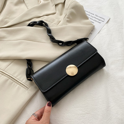 Σύγχρονη γυναικεία τσάντα με πλεκτή δερμάτινη λαβή και μεταλλική στερέωση