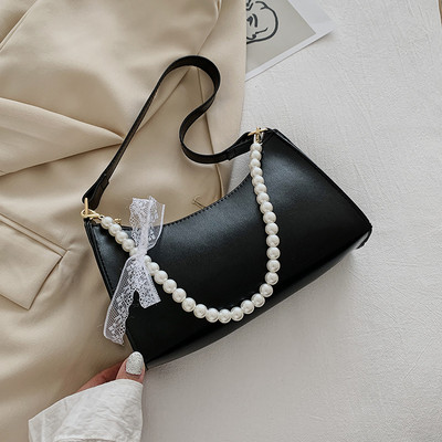 Γυναικεία έκο δερμάτινη τσάντα με κοντή λαβή από πέρλες και κορδέλα