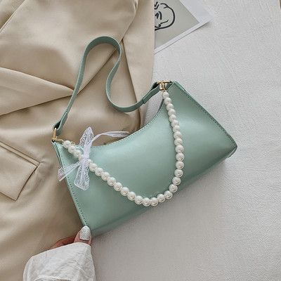 Γυναικεία έκο δερμάτινη τσάντα με κοντή λαβή από πέρλες και κορδέλα