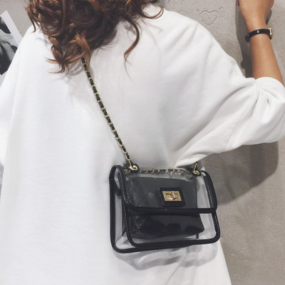 Διαφανής γυναικεία τσάντα με μακριά μεταλλική λαβή