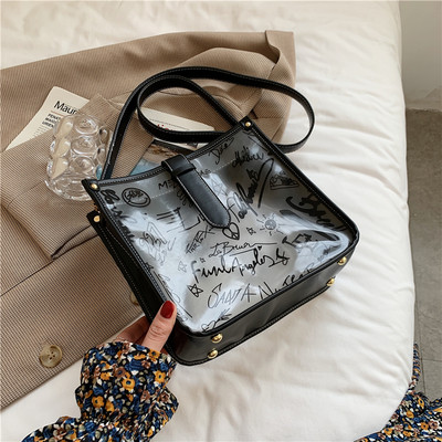 Γυναικεία διαφανής τσάντα με επιγραφή και μακριά λαβή