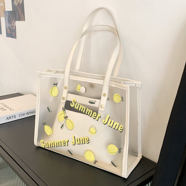 Caurspīdīga sieviešu ādas soma ar aplikāciju un uzrakstu